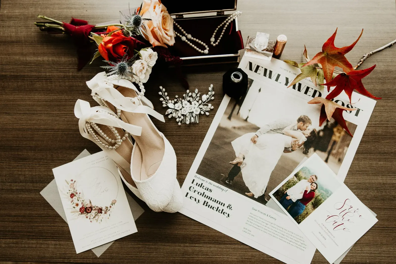Wedding invitation, shoes and jewellery laid flat